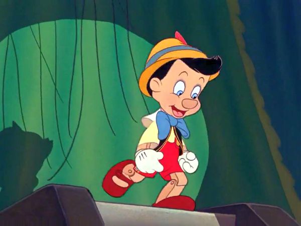 Image of Pinocchio breaking free from his strings.